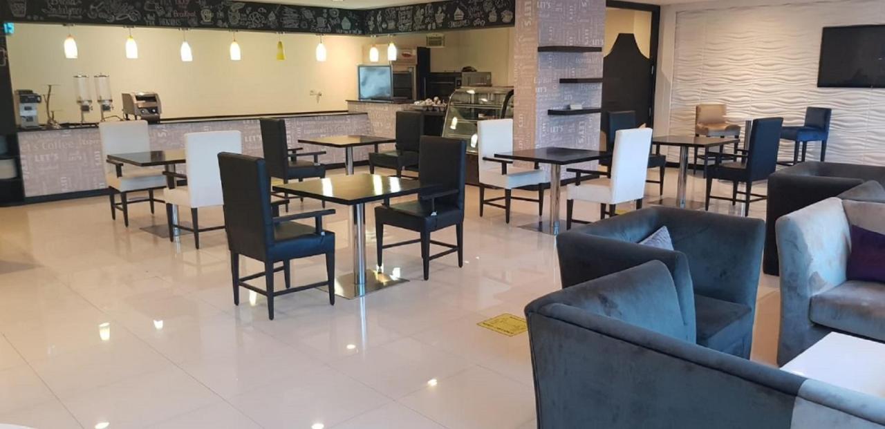 מנאמה Tulip Hotel & Suites מראה חיצוני תמונה